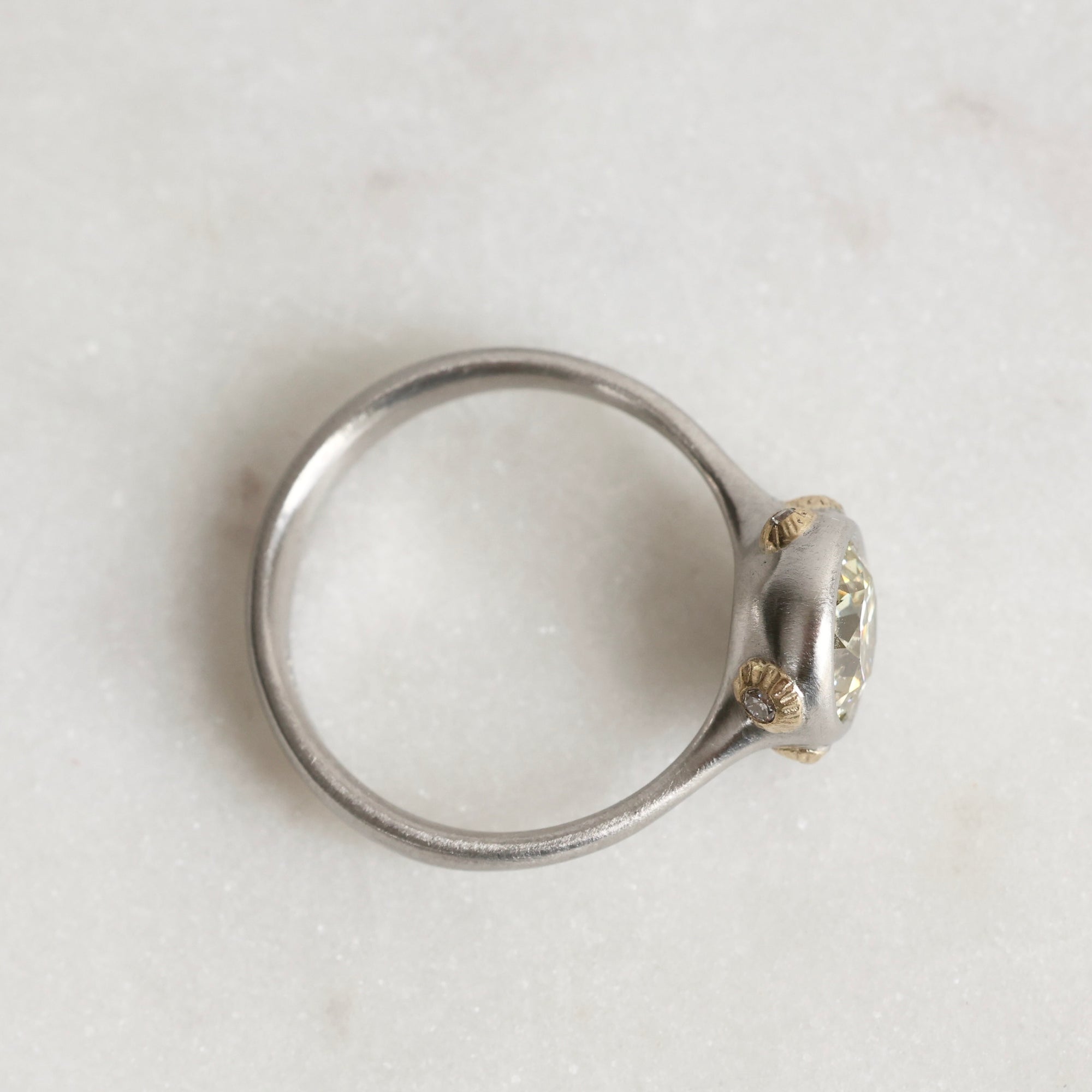 Platinum Ring with Gold Barnacles and a yellow diamond on a white background