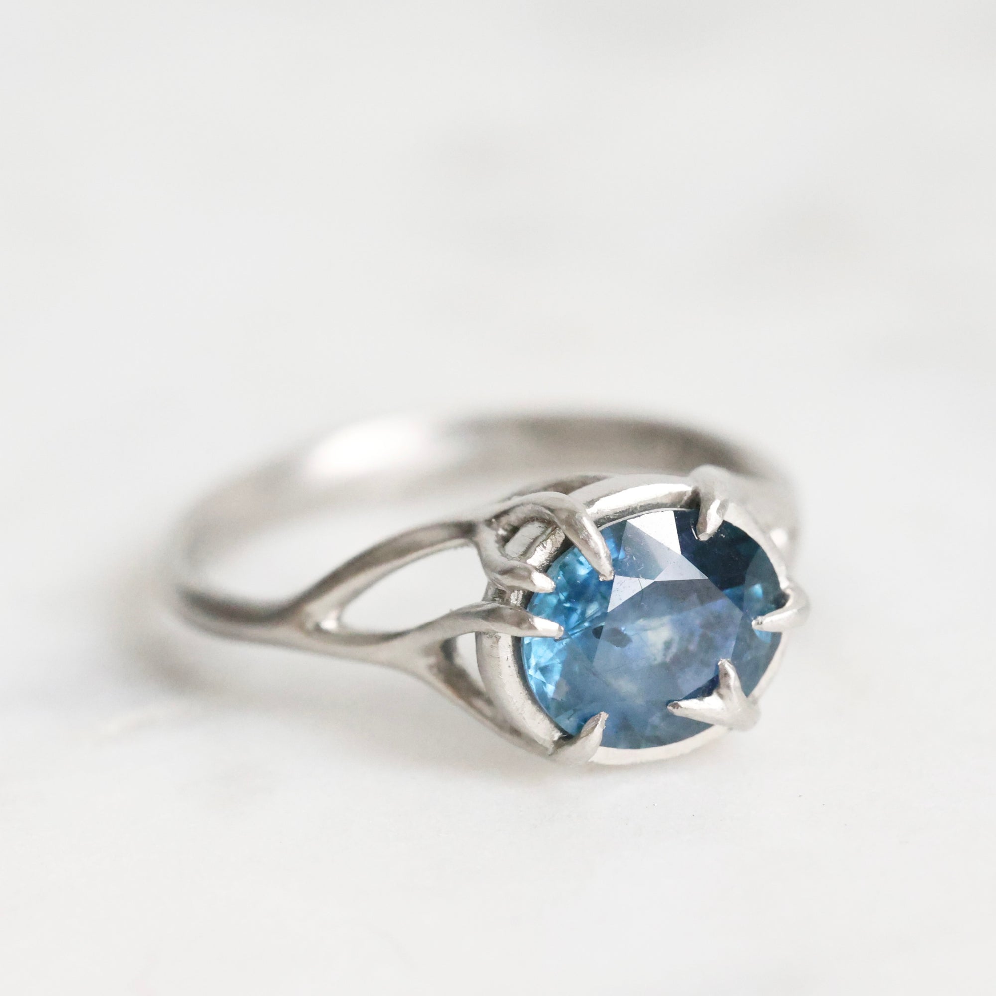 Platinum branchy ring with deep blue stone