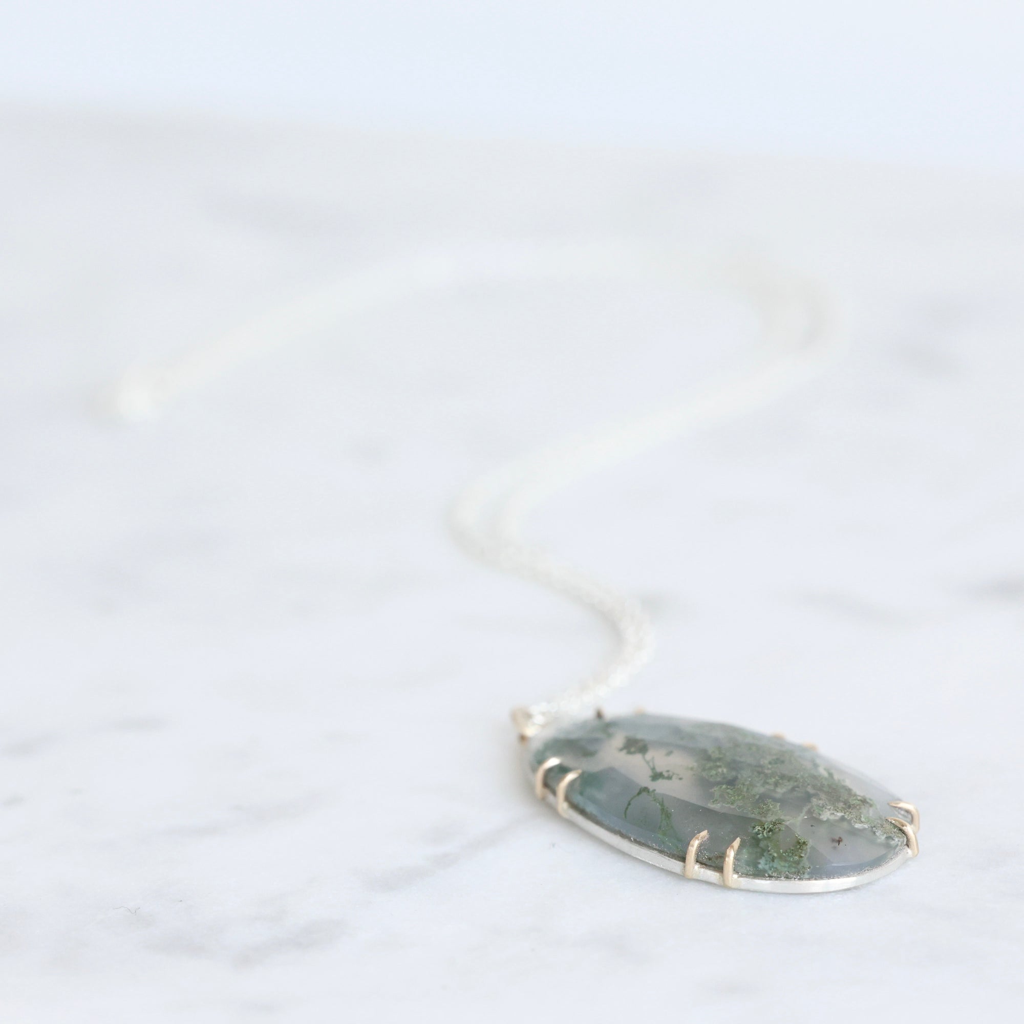 Necklace with a pendant on a white background