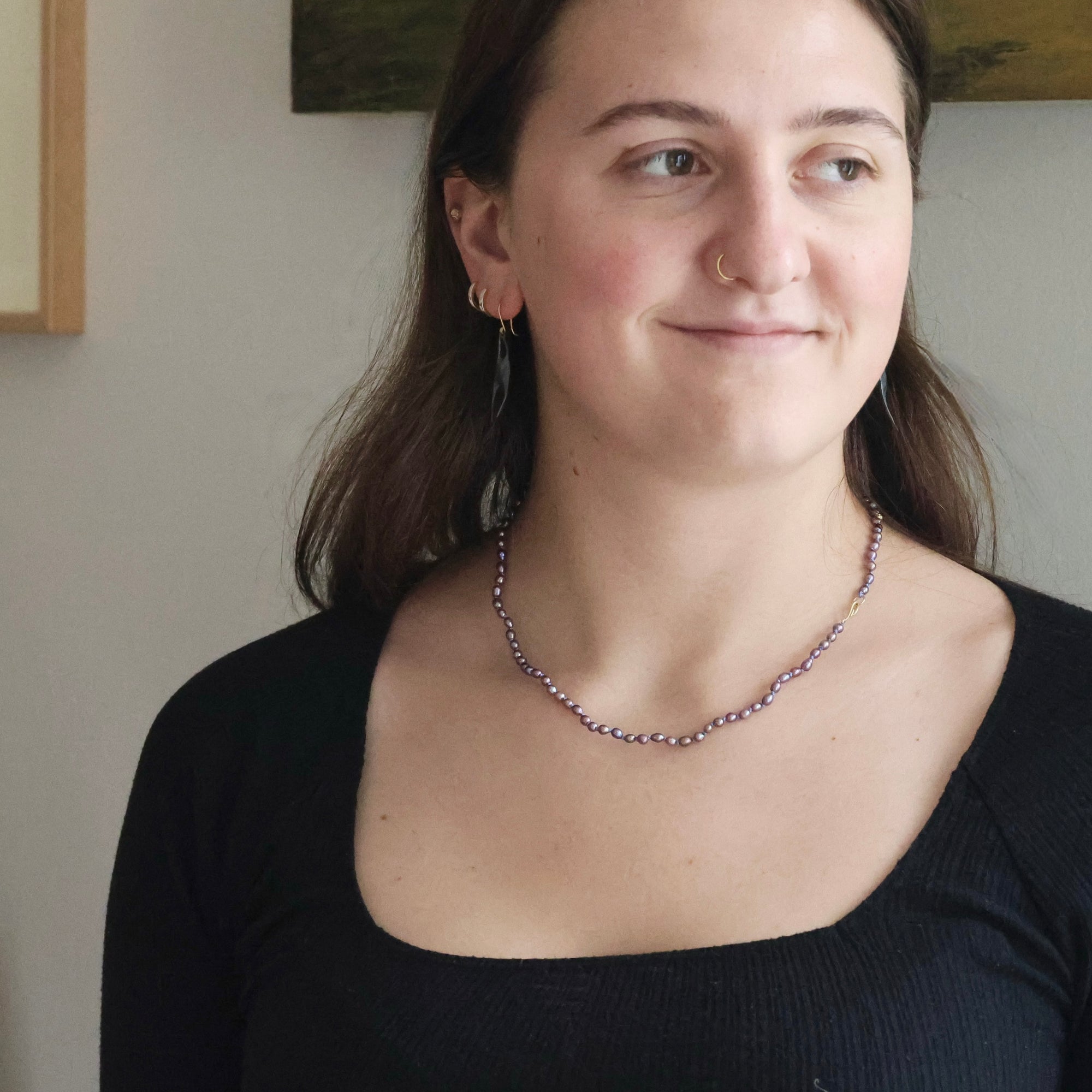 purple pearl strand on person