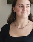 purple pearl strand on person