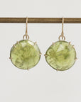 Green stone earrings on a white background