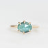 Green tourmaline ring with inclusions held in prongs