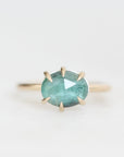 Green tourmaline ring with inclusions held in prongs