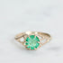 Green gemstone ring in gold branchy prongs