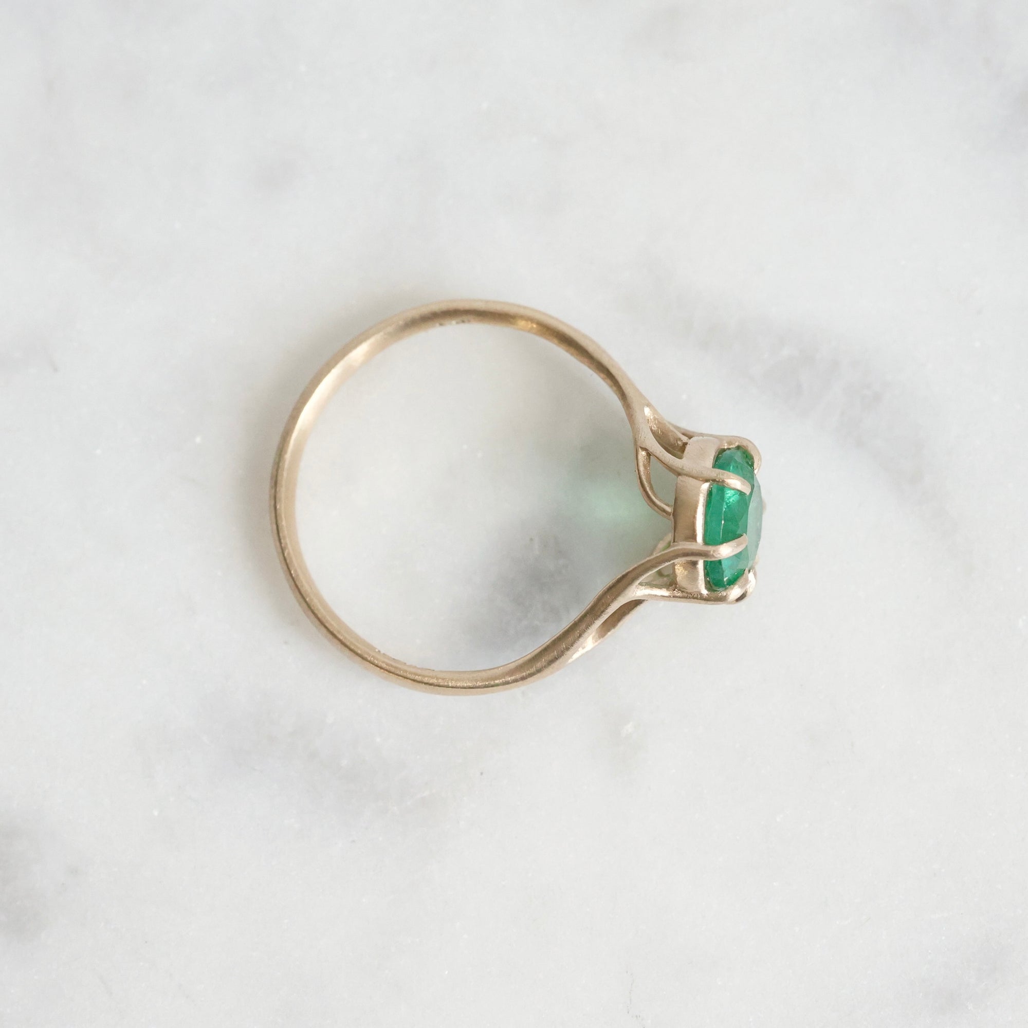 Green gemstone ring in gold branchy prongs