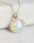 Opal pendant with gold prongs