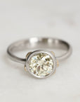Platinum Ring with Gold Barnacles and a yellow diamond on a white background