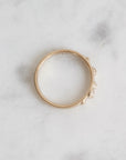Gold ring on a light marble surface