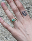 barnacle band stacked with green gemstone ring