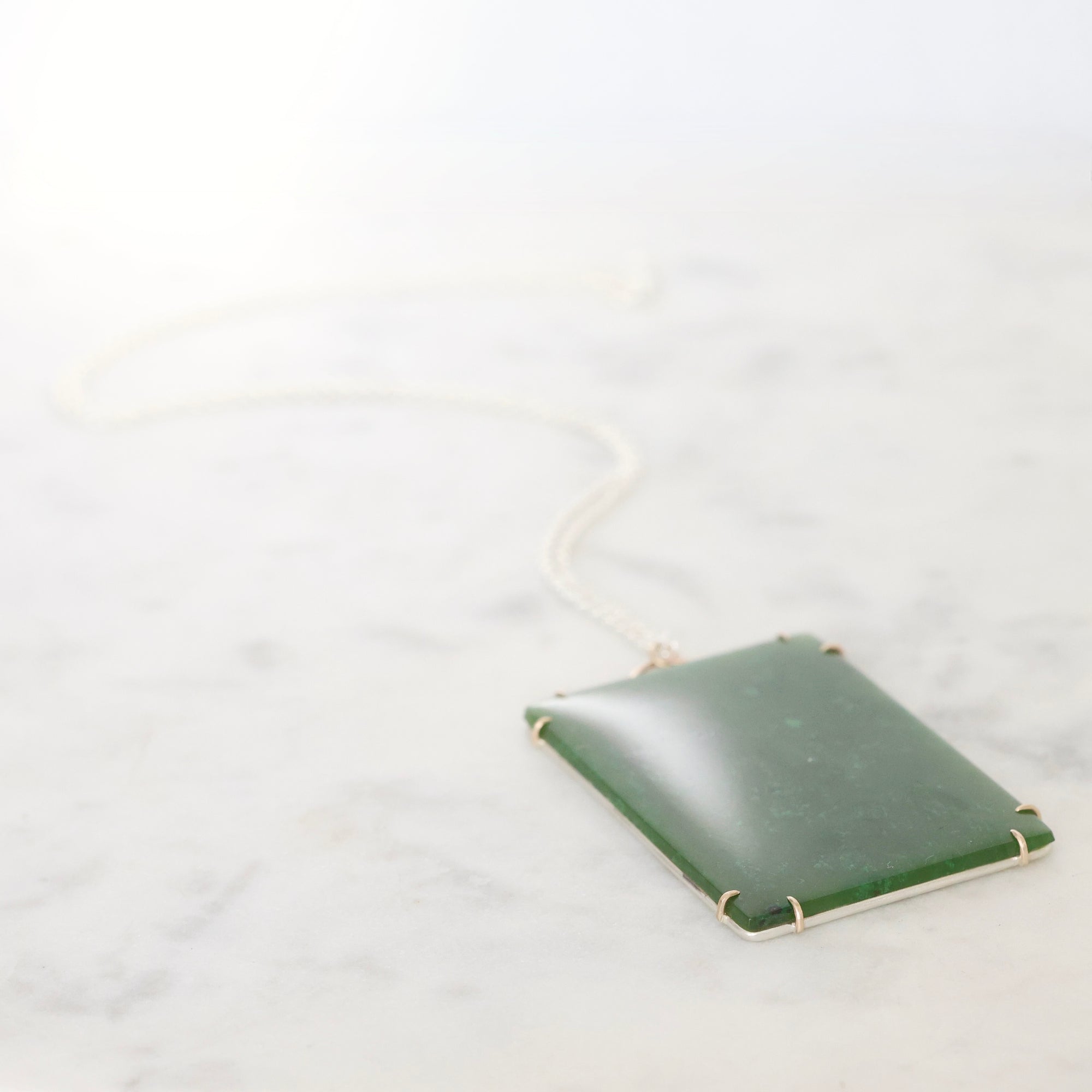 Large green rectangular stone pendant 
