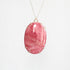 Large pink stone pendant in gold prongs