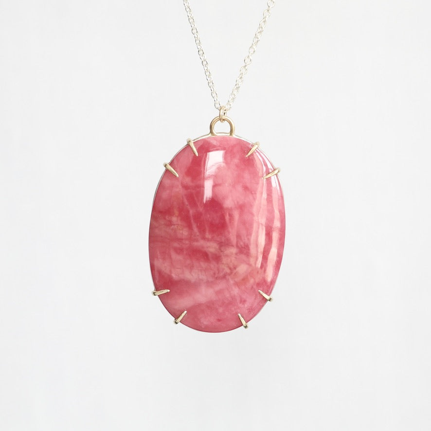 Large pink stone pendant in gold prongs