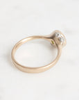 Gold ring with barnacle details on a white background