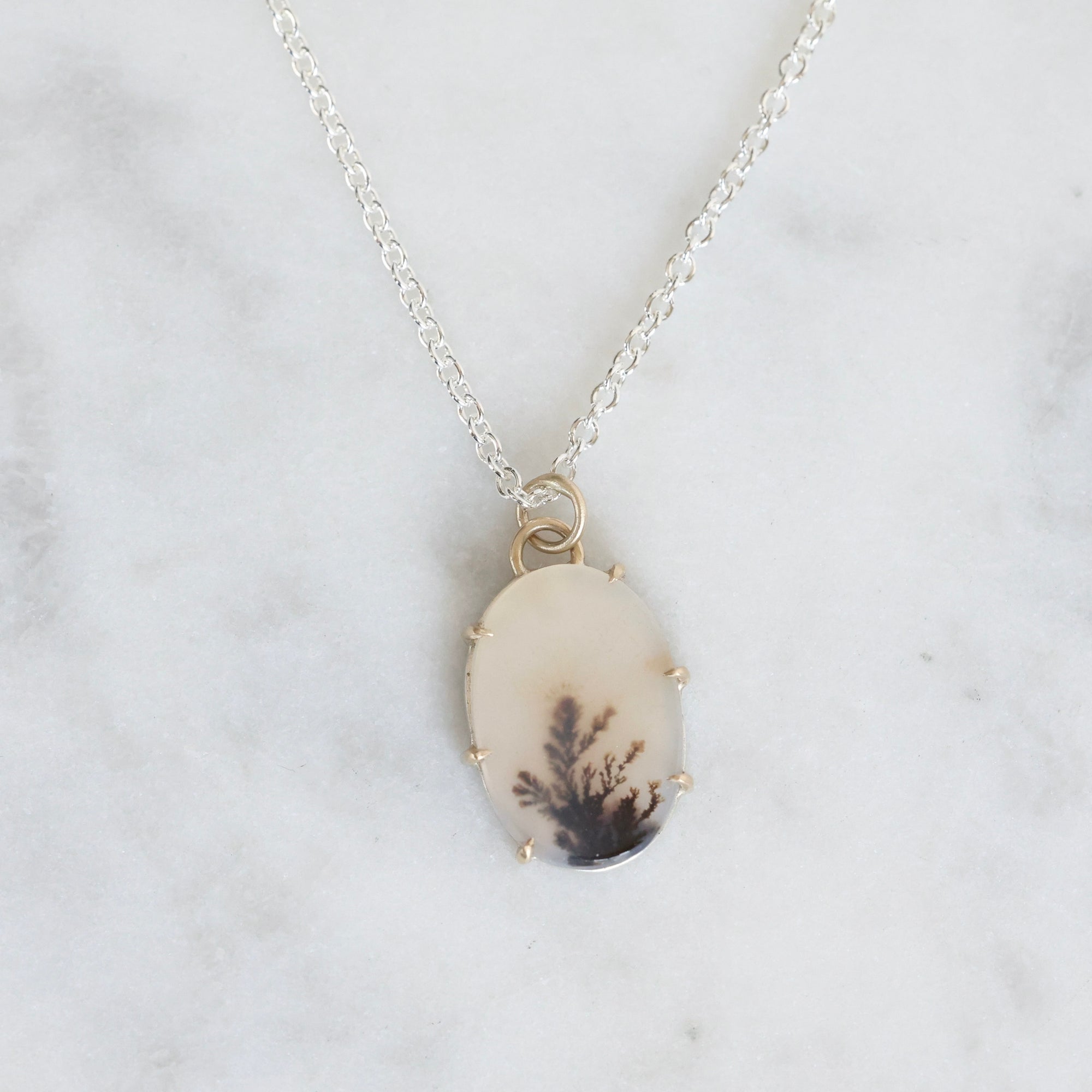 Necklace with a pendant on a marble background