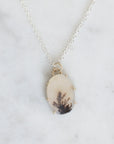 Necklace with a pendant on a marble background