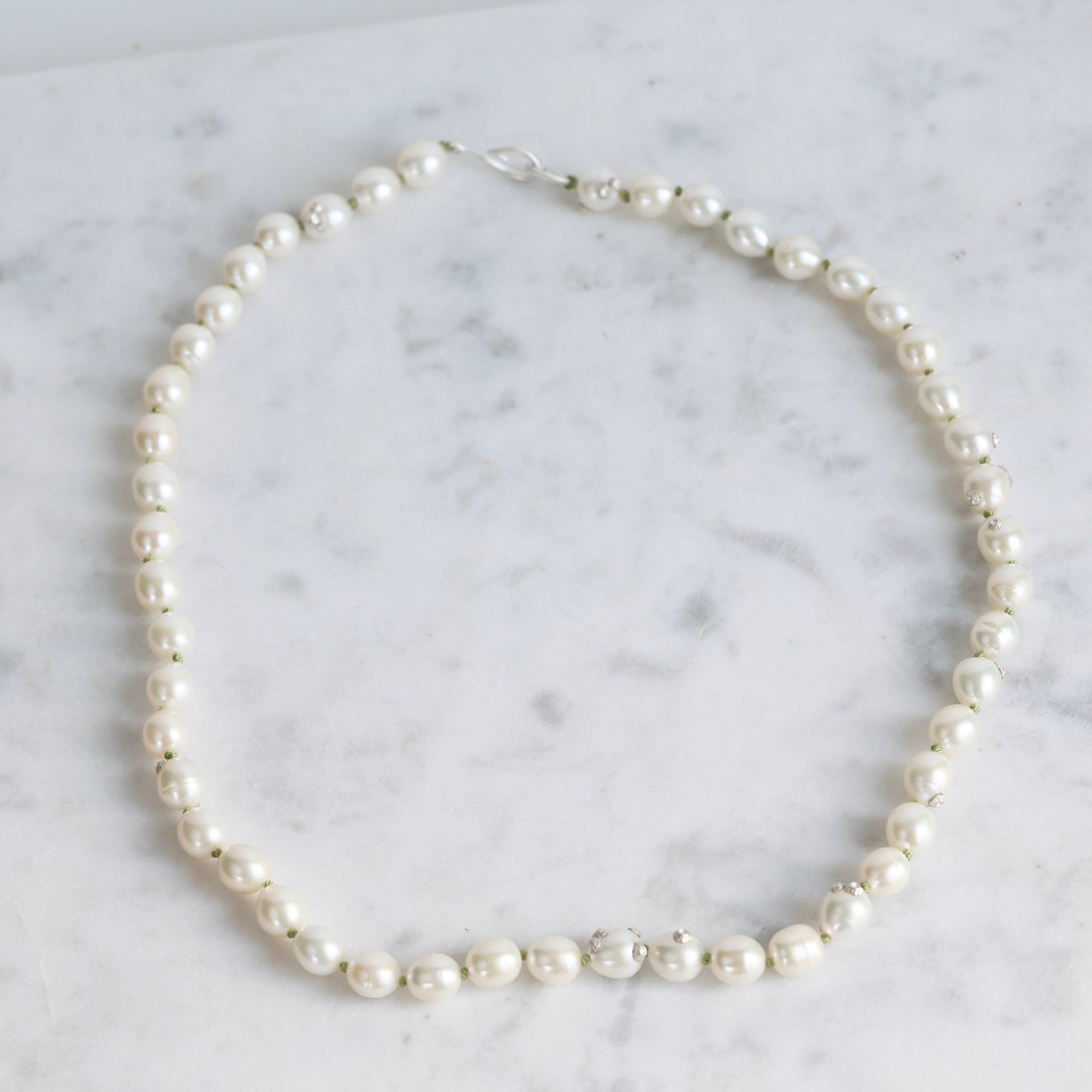 Pearl necklace on a marble surface