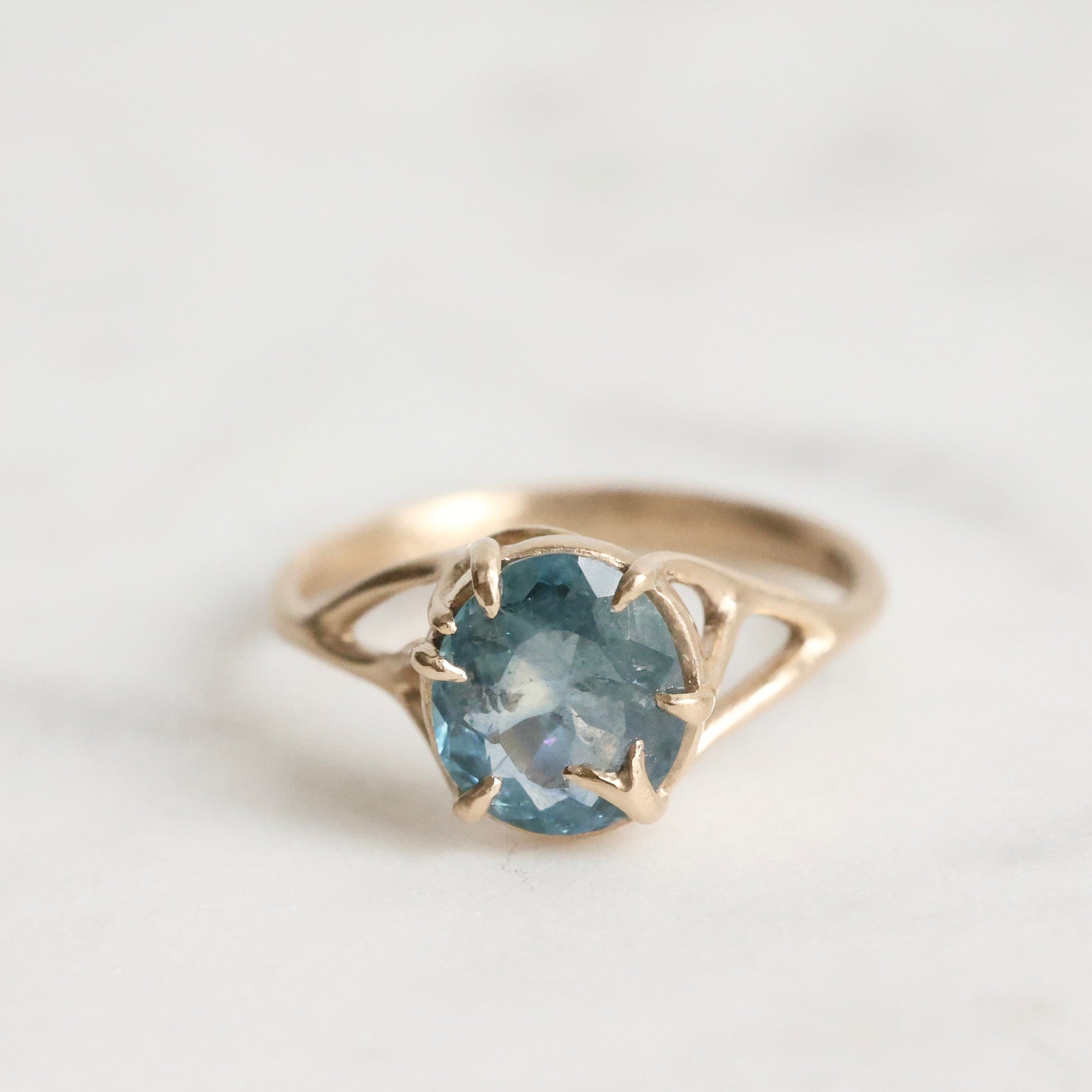 Gold branch ring with blue gemstone