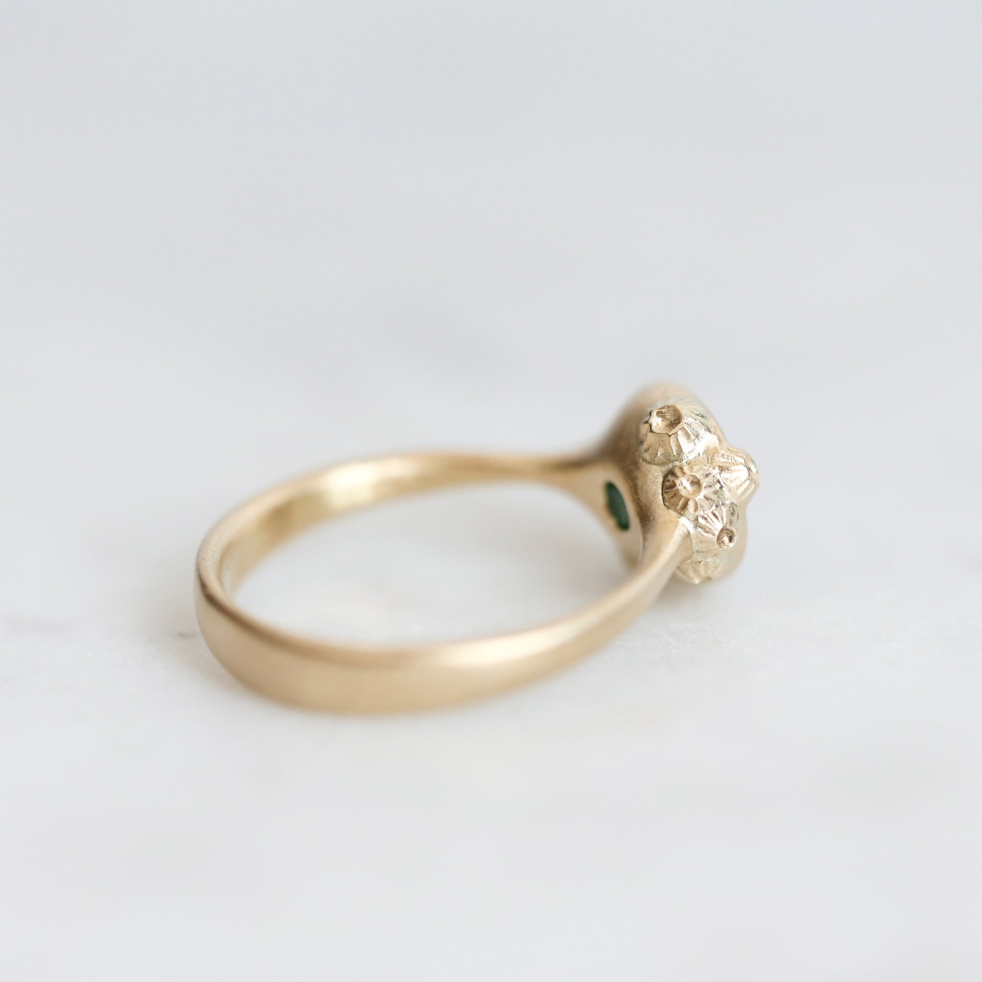 Back of gold Ruthie B. Ring with barnacles clustered