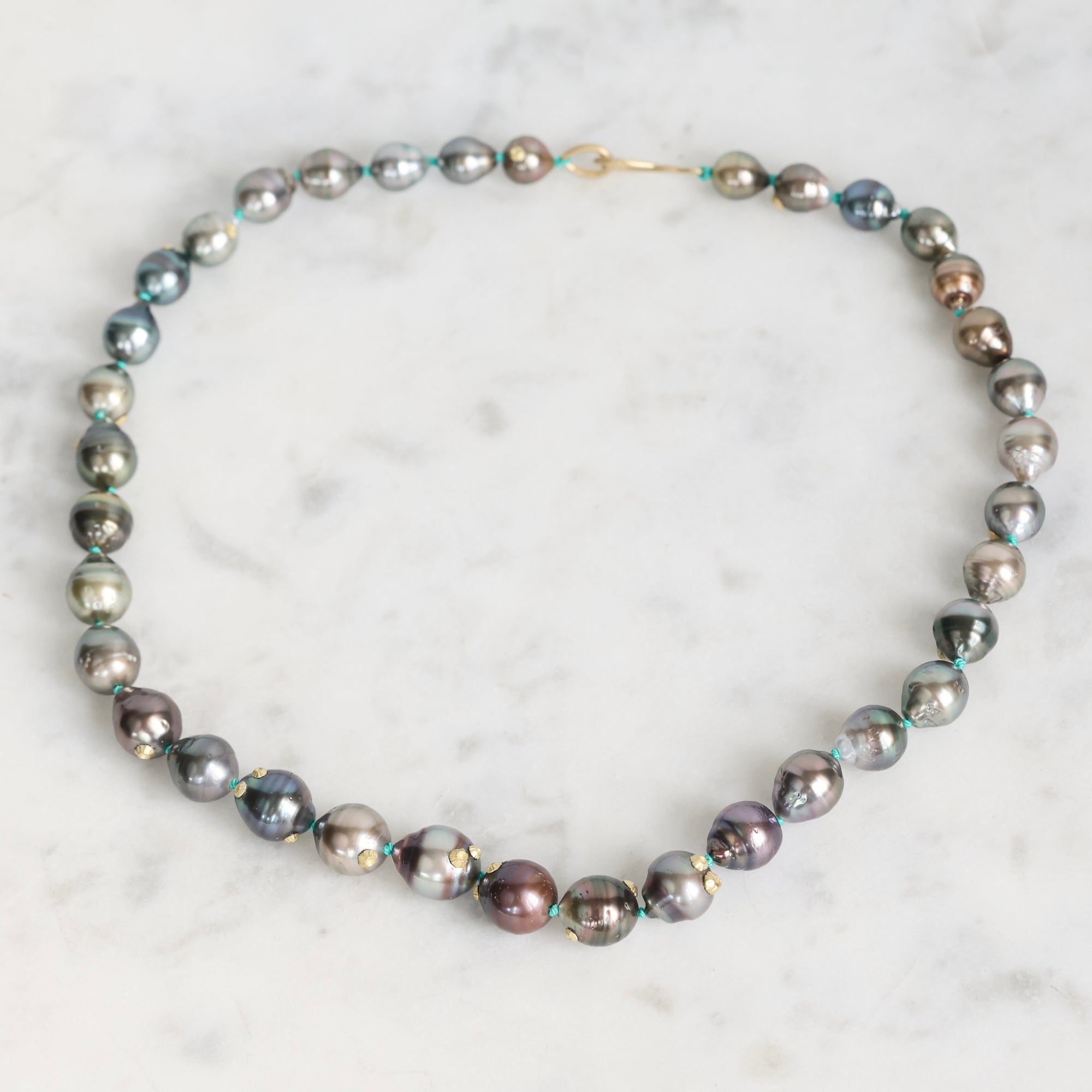Pearl necklace on a marble surface