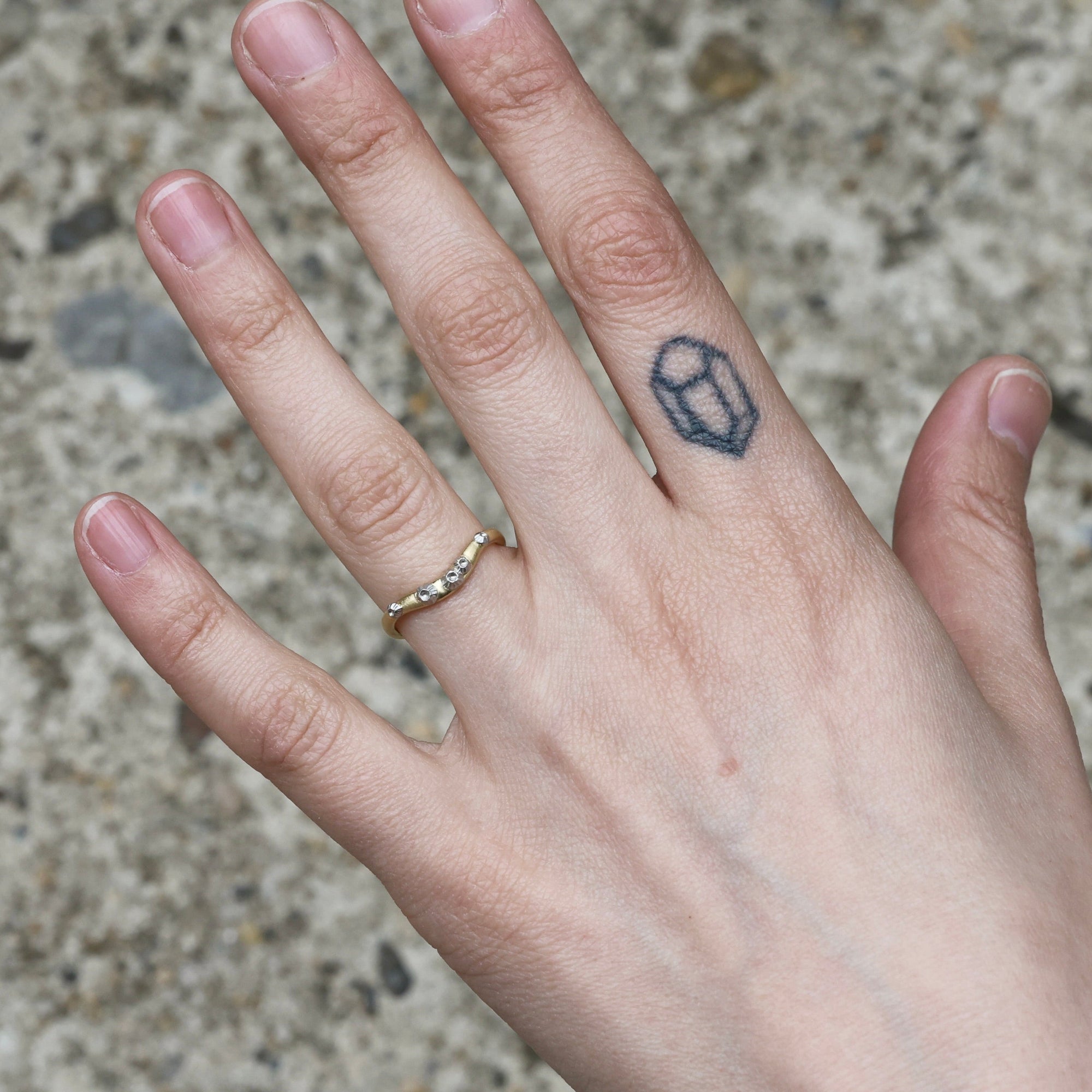 curved barnacle band on hand