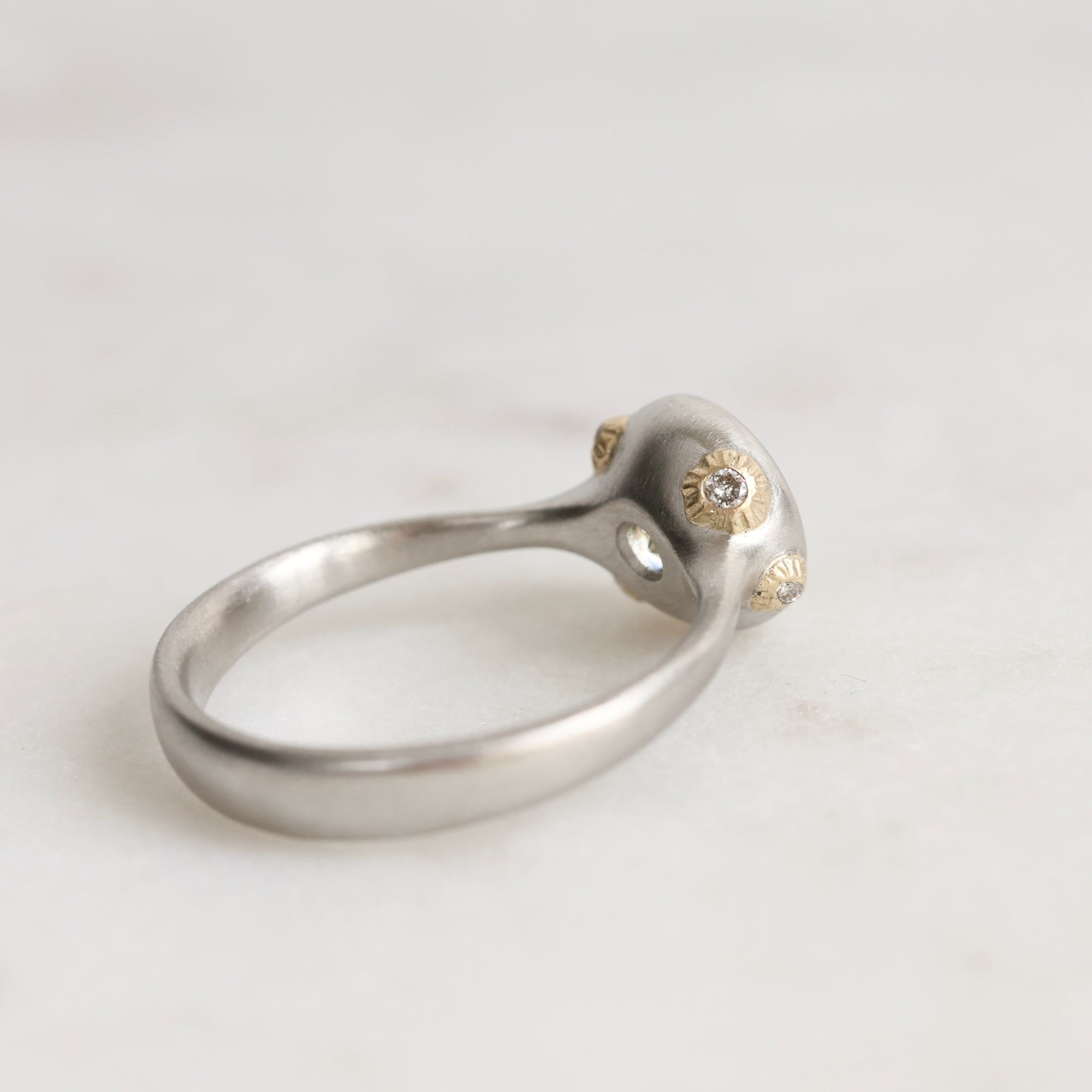 Platinum Ring with Gold Barnacles on a white background