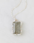 Necklace with a rectangular pendant on a light gray background