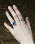 large blue stone ring on hand