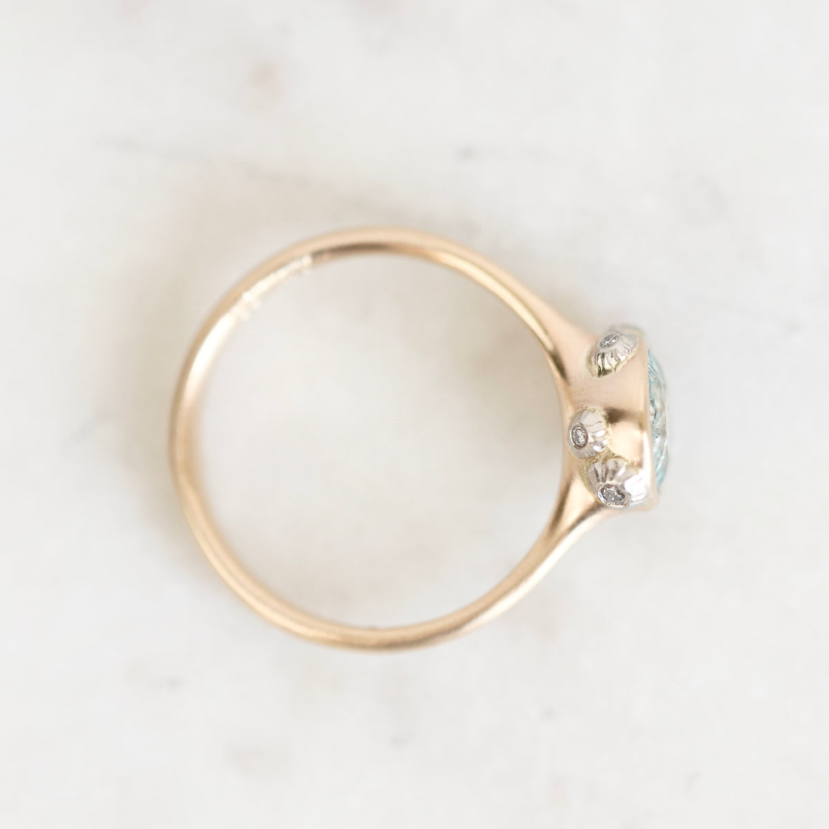 Bezel ring with platinum barnacles from above. 