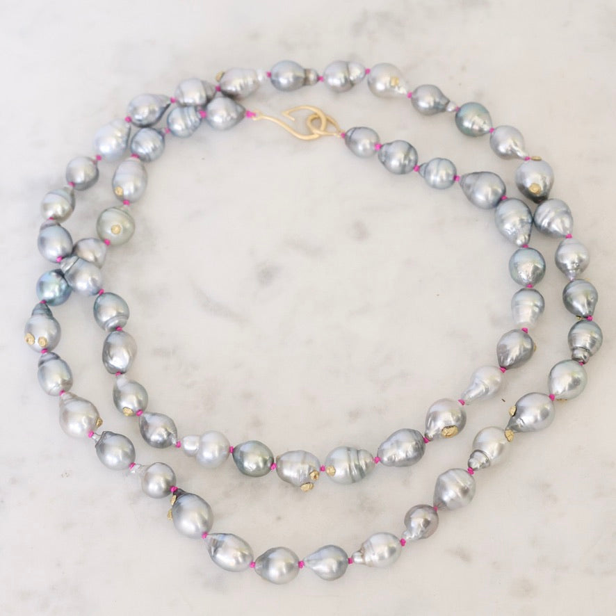 Pearl necklace on a marble surface