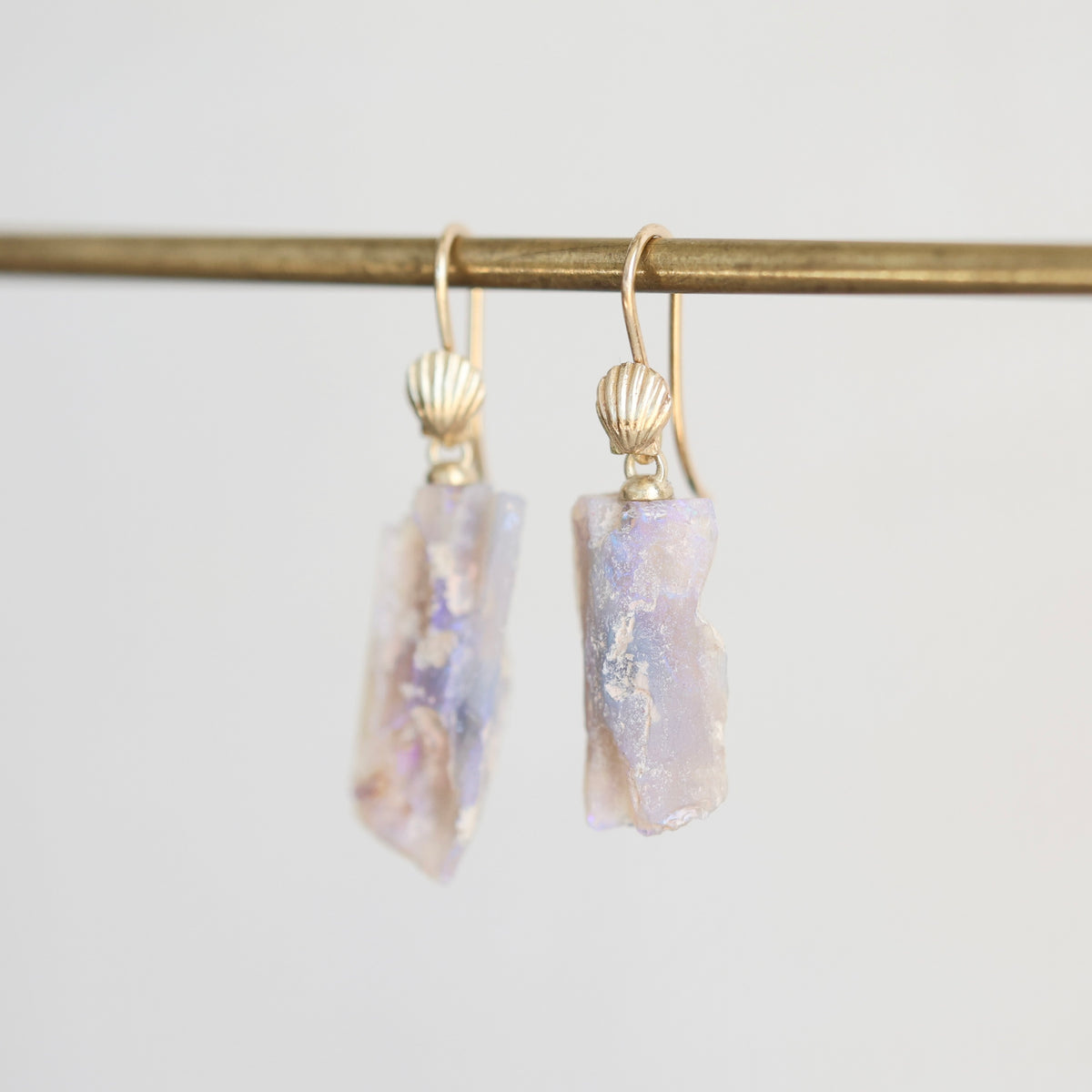 Fossilized opal drop earrings with scallop shell ear wires in 14k yellow gold. 