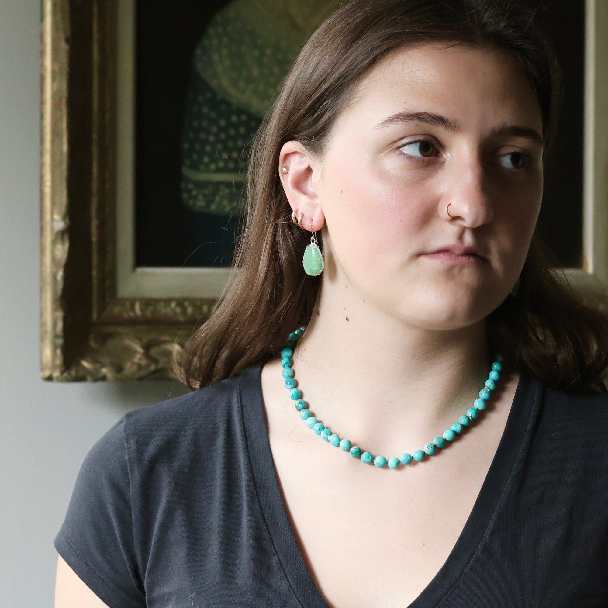 woman wearing beaded turquoise strand