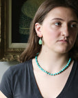 woman wearing beaded turquoise strand