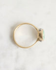 Gold ring with a gemstone on a white background