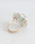 Back of wreath ring with gold band branching into setting
