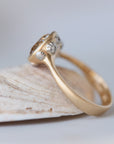 Gold ring with diamonds on a light background