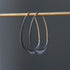 blackened silver hoops with gold ear wires