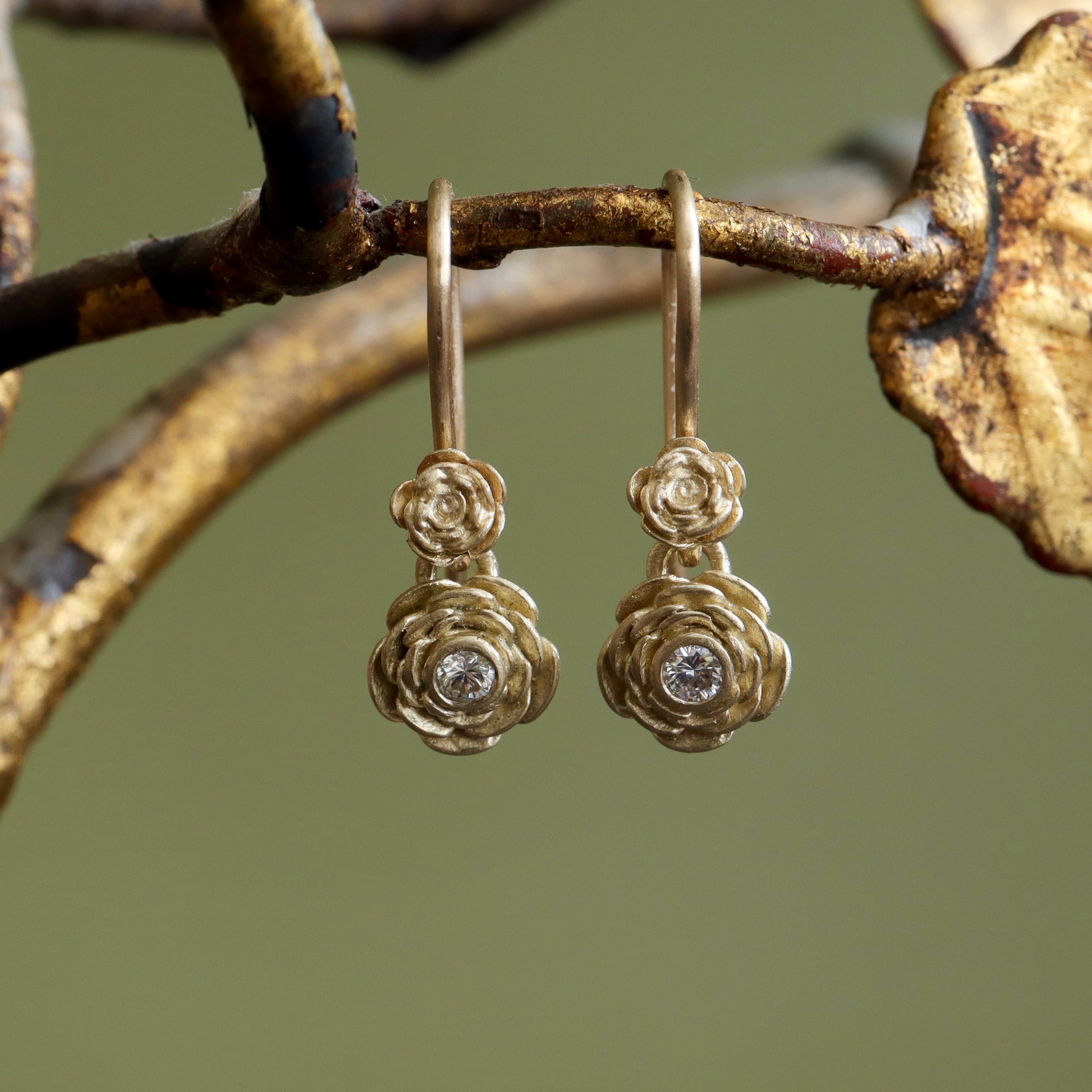 Hand carved rose drop earrings with diamond by Hannah Blount