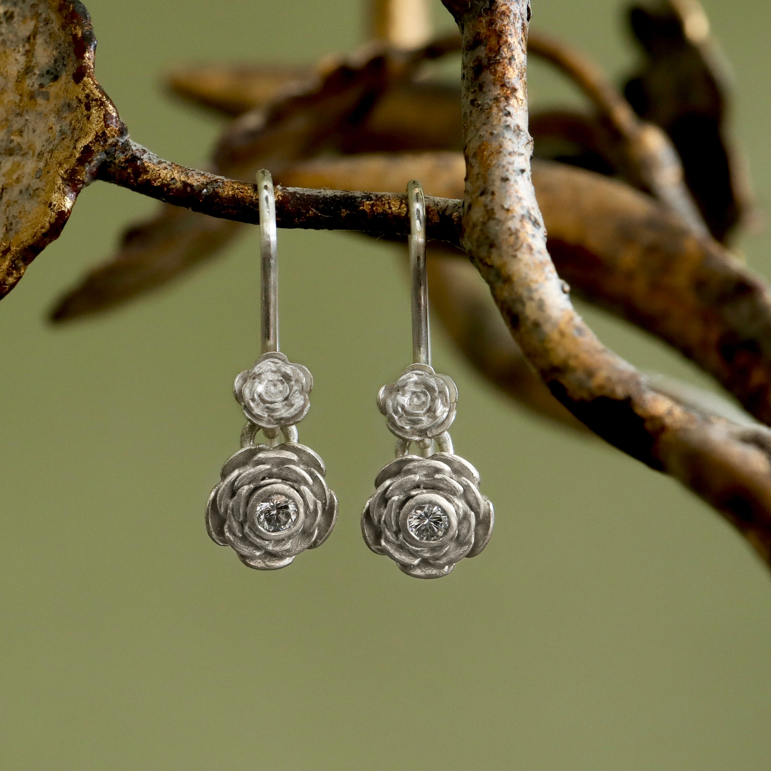 Hand carved rose drop earrings with diamond by Hannah Blount