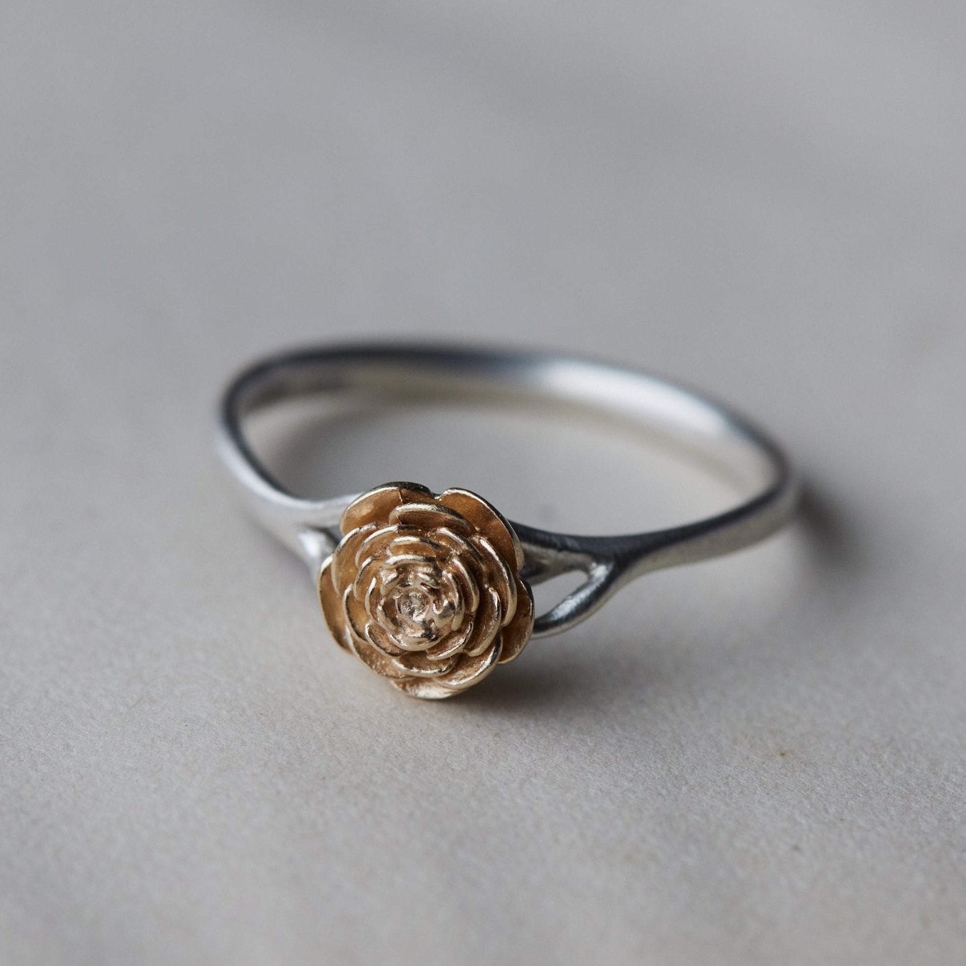 large rose garden ring, silver band with gold rose