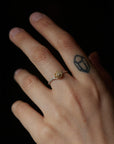 Medium gold and silver rose ring, shown on hand