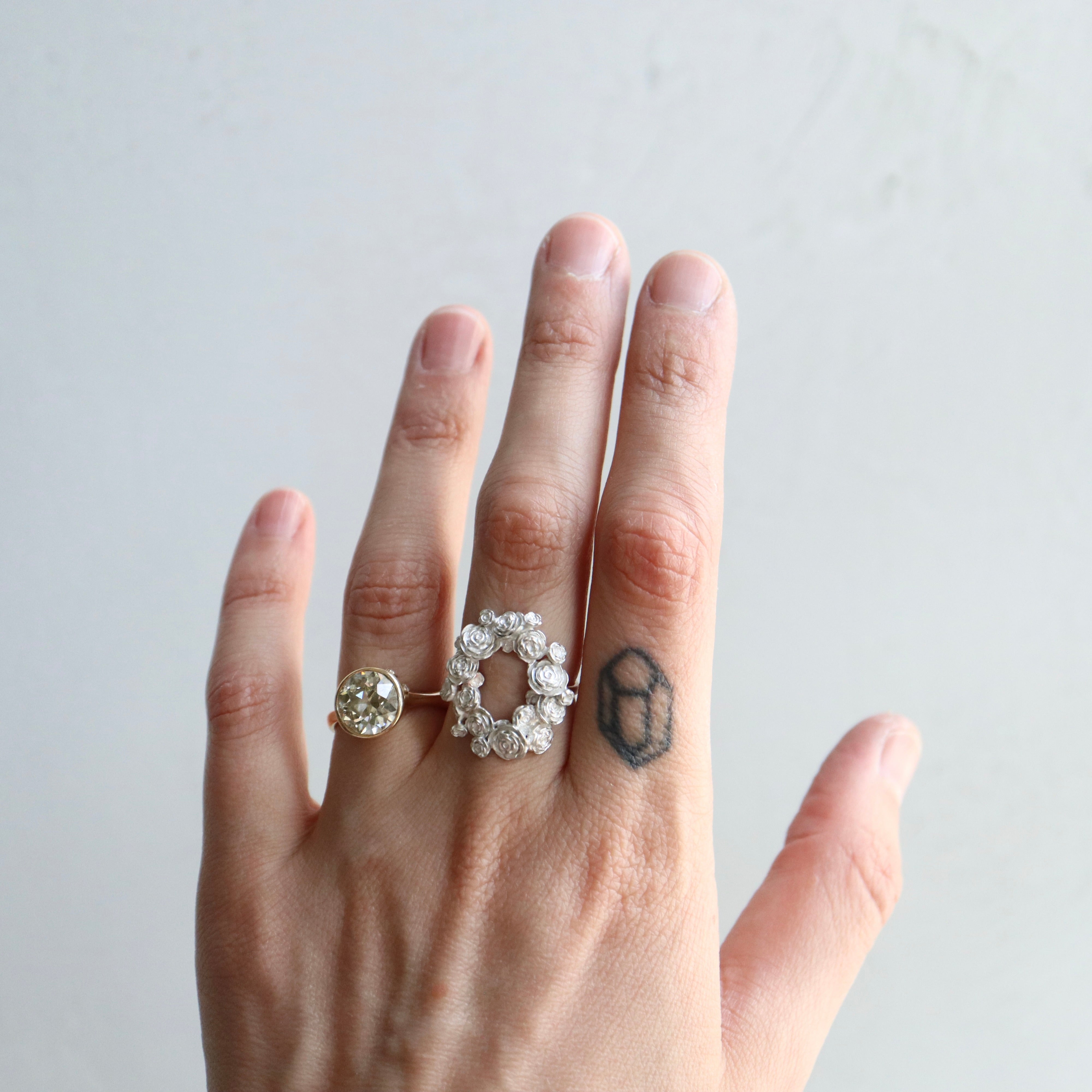 wreath of silver flowers with gold band- on person