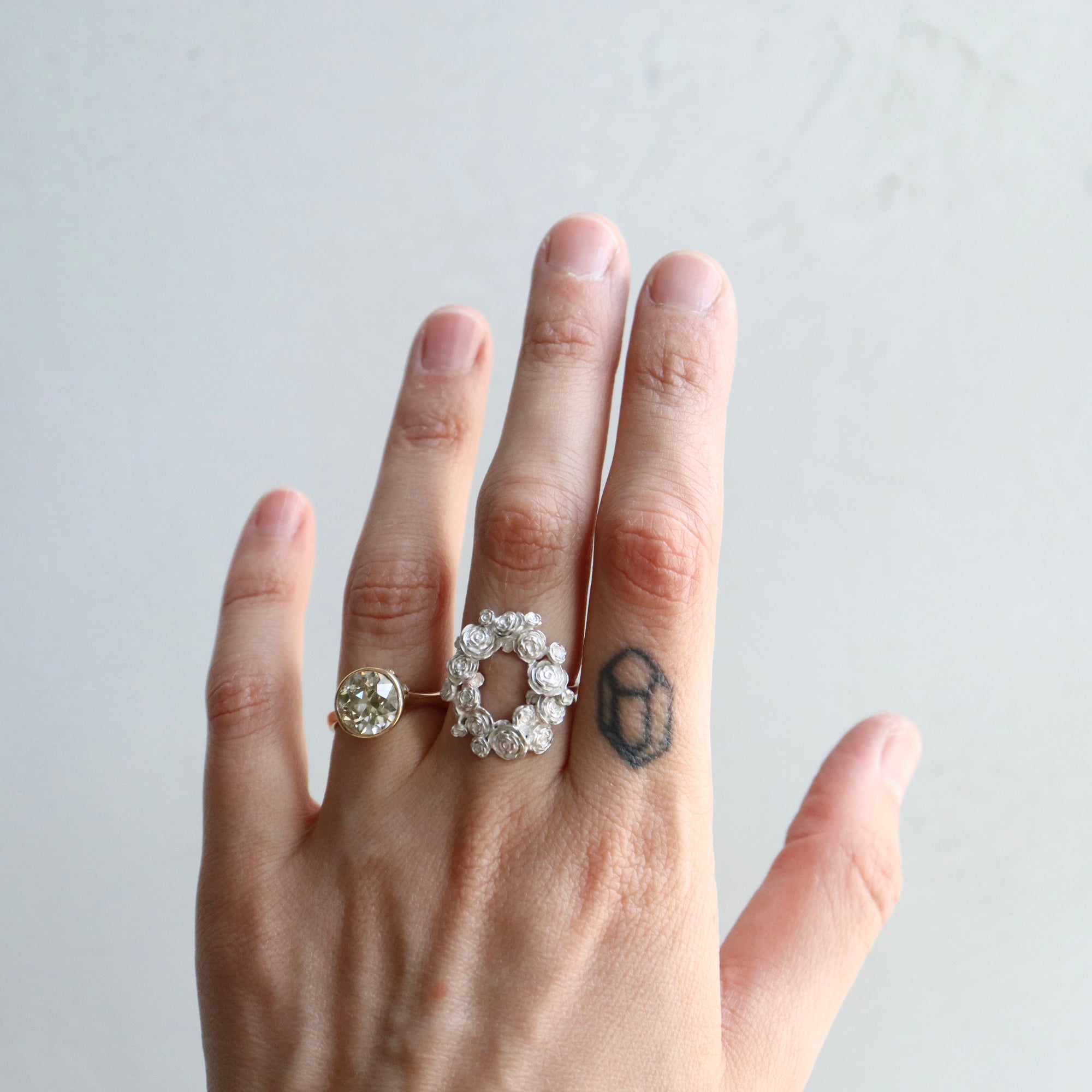 wreath of silver flowers with gold band- on person