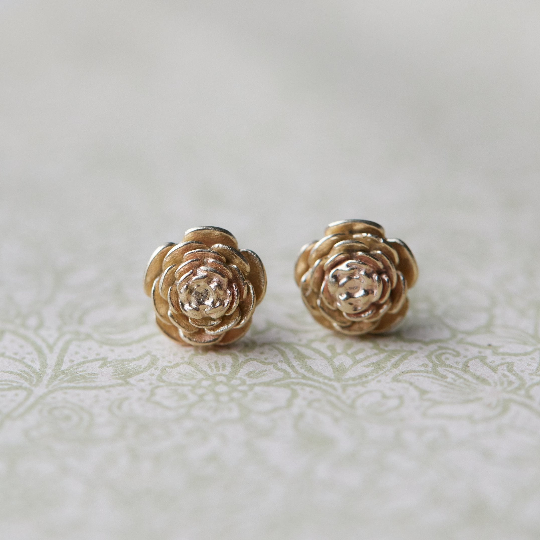 large pair of gold rose studs
