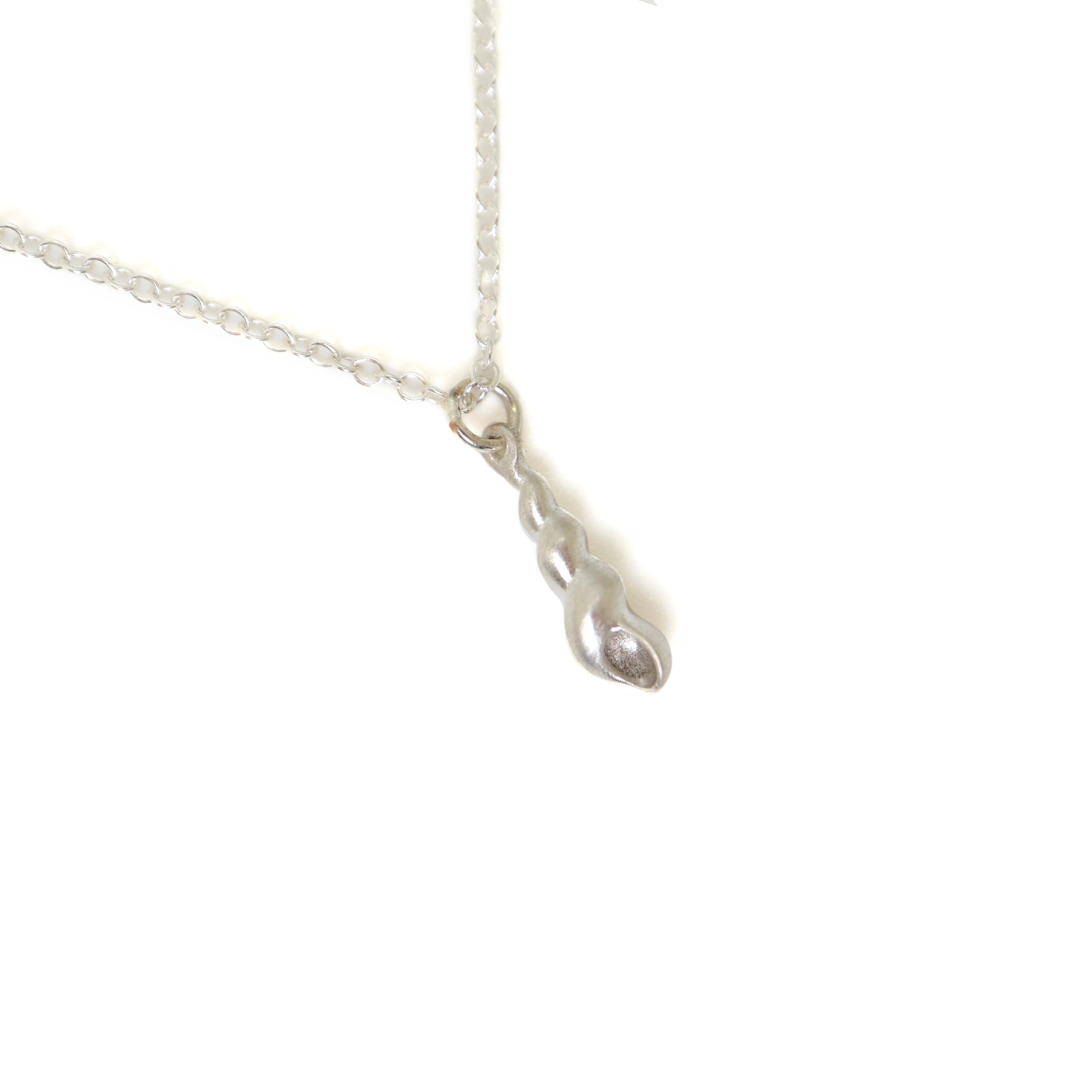 Tiny handcarved turret shell in silver by Hannah Blount