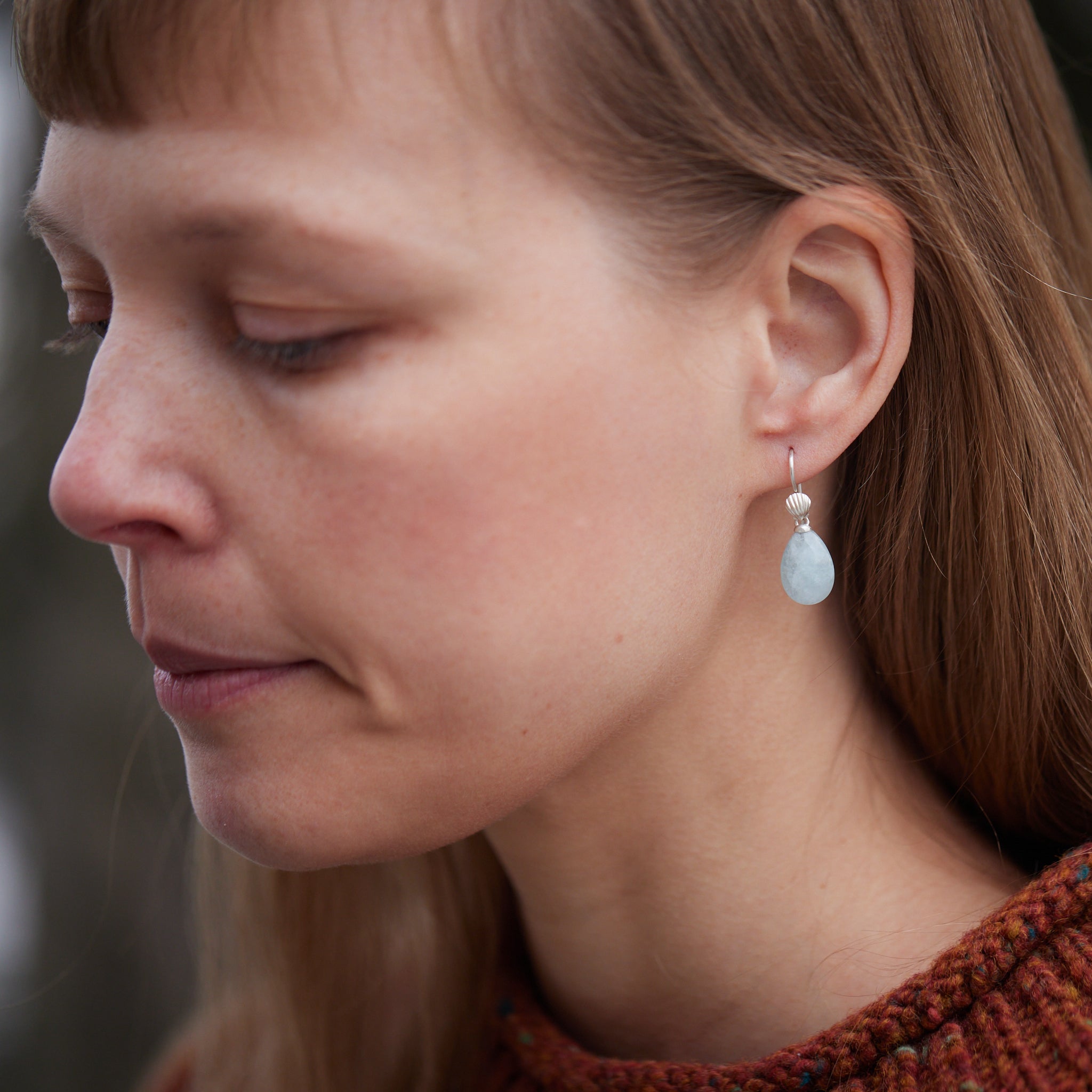 teardrops of pale, icy aquamarine hang beneath little silver scallop shell ear wires