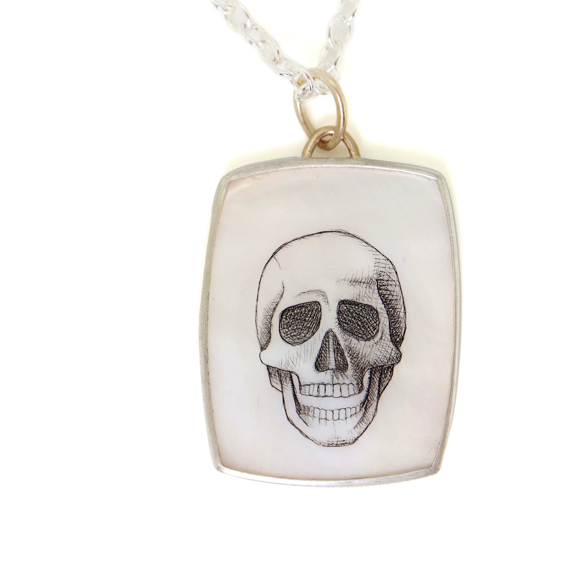 Skull scrimshaw on mother of pearl - necklace
