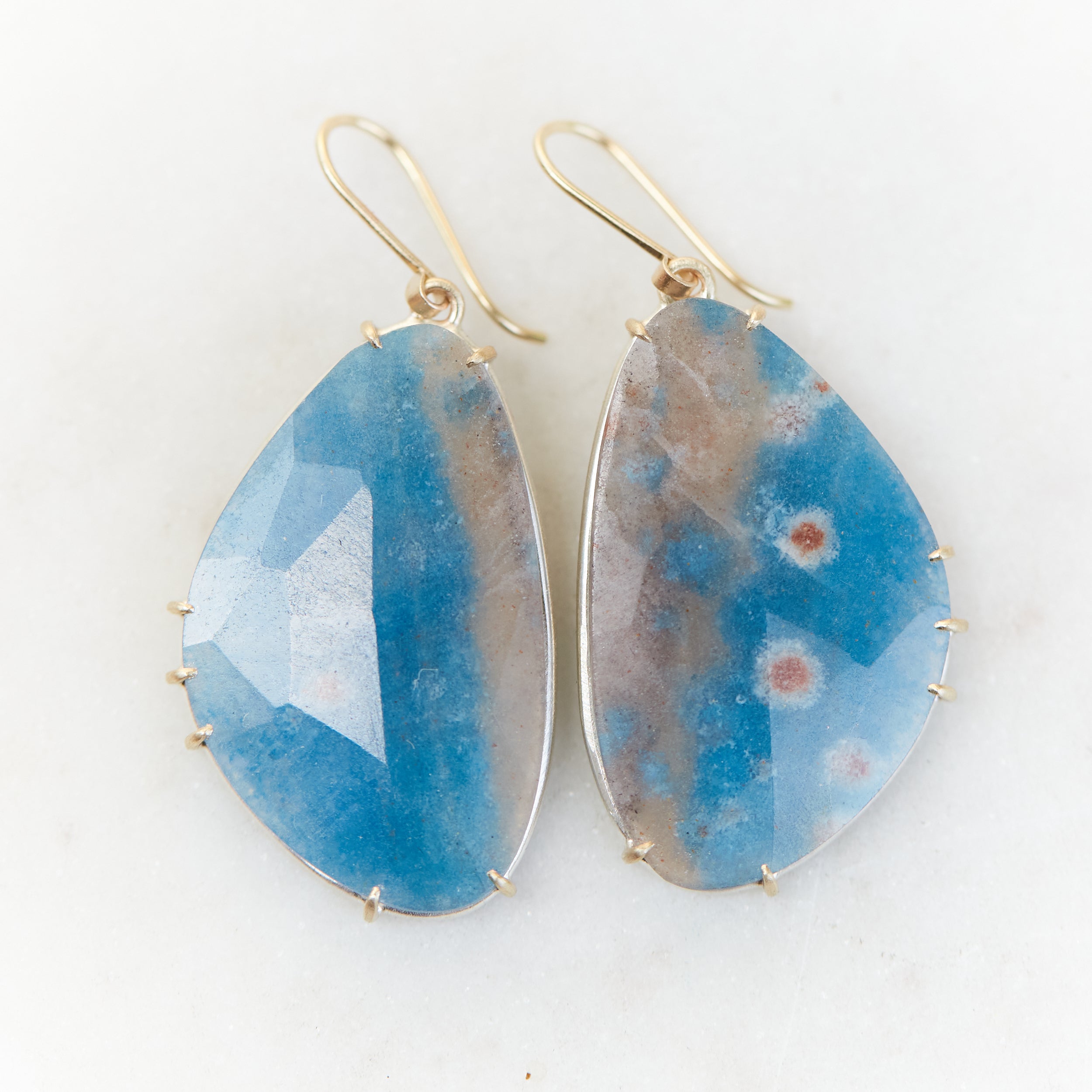 Blue pansy butterfly paraiba in quartz earrings with prongs by hannah blount jewelry