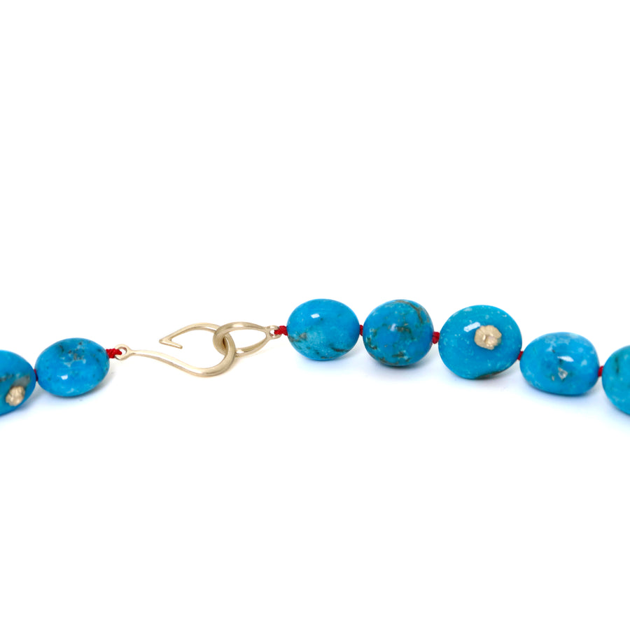 detail of kingman Turquoise beaded necklace with red silk by hannah blount