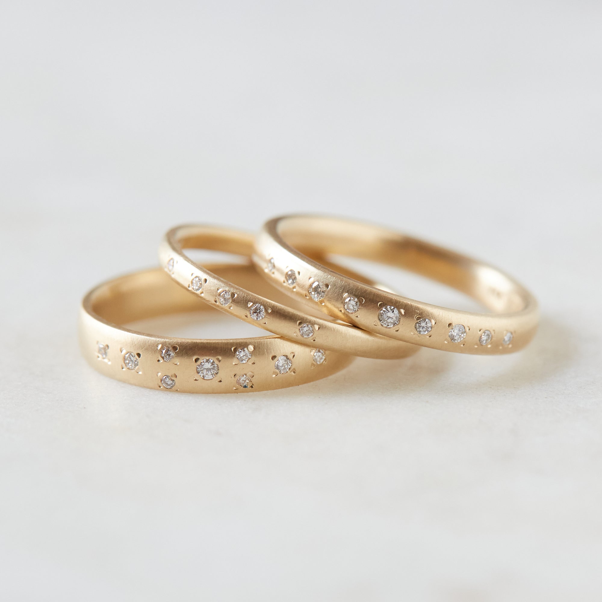 Ovoid gold band with diamonds by Hannah Blount